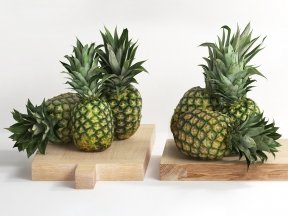 Pineapples on Wooden Board